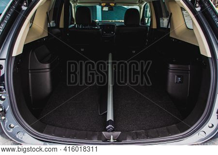 Moscow, Russia - January 30, 2021 Mitsubishi Outlander Dark Interior View With Opened Trunk. Third G