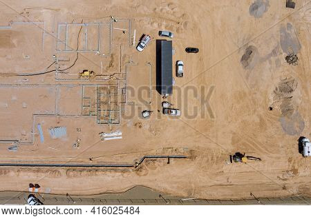 Aerial View Construction Work In The Laying Pipes In The Foundation For New Residential Complex Buil