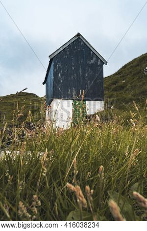 Bour Village Grass-covered Picturesque Houses At The Faroese Coastline In The Village Bour With View