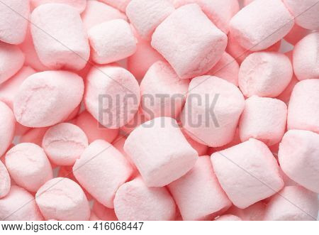 Mini marshmallows of  light pink color. Selective Focus. Flat lay.