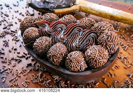Brazilian easter egg stuffed with granulated chocolate and cream, tasted with a spoon. Easter tradition in Brazil