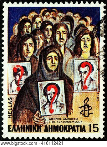 Moscow, Russia - April 06, 2021: Stamp Printed In Greece Shows People Looking For Their Lost Relativ