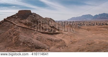 Zoroastrian Tower Of Silence With The City Of Yazd In The Background. Historic Burial Site In Ancien