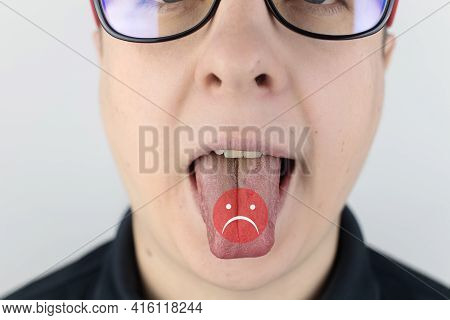 A Man With Bad Breath Looks At The Camera. Fetid Odor Concept. Close-up Of A Person Who Hears A Sten