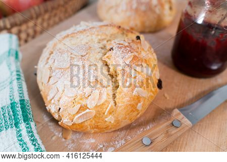 Freshly Baked, Homemade Sweet Cake With Almonds And Raisins On Wooden Board. Easter Loaf. Knife With