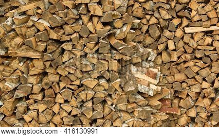 Freshly Cut Birch Firewood. Firewood Background. Stacks Of Firewood