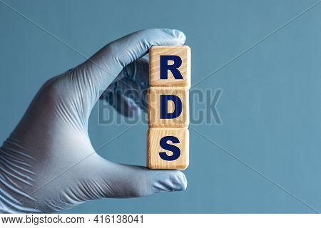 Rds (respiratory Distress Syndrome) Is An Acronym On Cubes Held By A Hand In A Blue Glove. Medical C