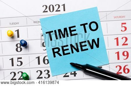 The Calendar Has A Blue Sticker With The Text Time To Renew And A Black Marker. Organizational Conce