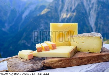 Cheese Collection, French Beaufort, Abondance, Emmental, Tomme De Savoie Cheeses Served Outdoor In S