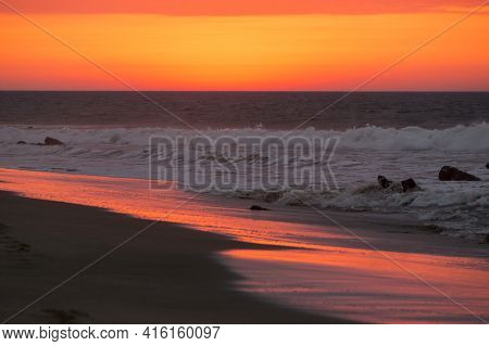Beautiful Orange Purple Sunset On The Beach Of Punta Sal, Near Mancora, Peru.