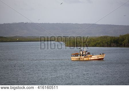 Morrocoy, Venezuela, April 22: Old Rusted Fishing Boat On His Way To The Harbor Of Tucacas With Suns
