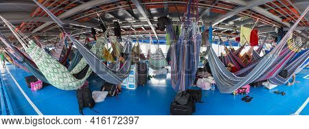 Amazon, Brazil - March 18: Panorama Of People Resting In Hammocks On Passenger Boat Deck Going Down 