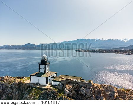 Aerial View Of Revellata Lighthouse On A Rocky Outcrop Near Calvi In The Balagne Region Of Corsica W