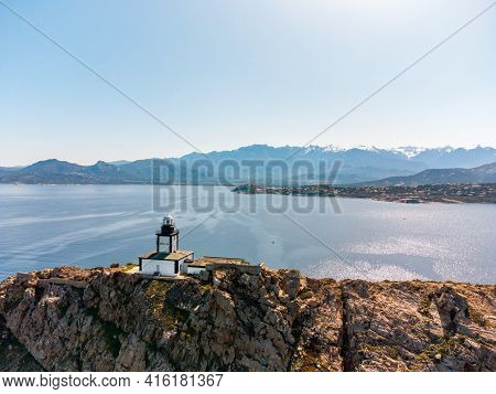 Aerial View Of Revellata Lighthouse On A Rocky Outcrop Near Calvi In The Balagne Region Of Corsica W