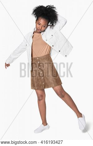 African American girl in white jacket and brown outfit street fashion shoot full body