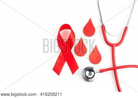 Awareness Oncept With Blood Drop And Red Ribbon. World Hamophilia Day Or Blood Donor Day
