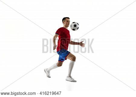 Porttrait Of Young Soccer Football Player Training Isolated On White Background.