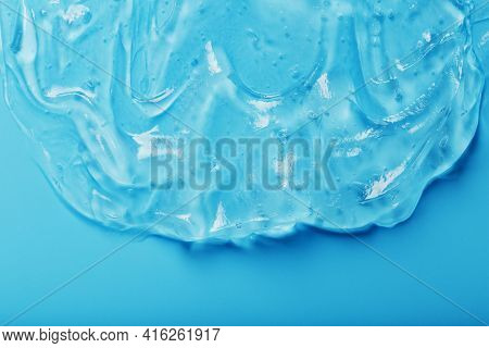 Antiseptic Gel On A Blue Background In Waves.