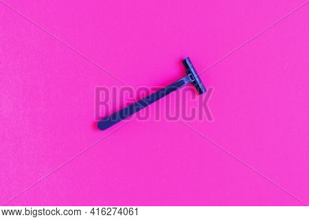 Non-permanent Blue Plastic Shaving Machine Isolated On Pink Background.