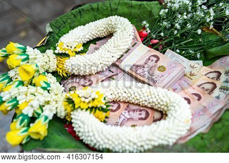Thai Banknote 1000 Baht in Phan (tray with pedestal) with graland to make merit and to donate money to charity in Thai Traditional way.