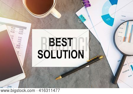 Best Solution Is Written In A Document On The Office Desk With Office Accessories, Coffee, Diagram A