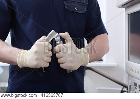 An Anesthesiologist With Laryngoscope In His Hands.tracheal Intubation. Preparation Of Equipment For