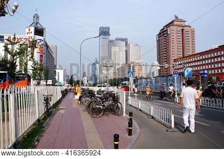 BEIJING, CHINA - JULY 2006: Beijing, China a city where a thousand new cars are added to the road everyday, bicycles are stiil a major form of transportation.