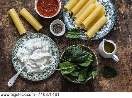 Ingredients For Cooking Fresh Cannelloni Pasta With Spinach And Ricotta Baked With Mozzarella Cheese