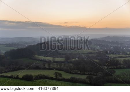 Stunning beautiful sunrise landscape image of Colmer\'s Hill in Dorset on a Spring morning