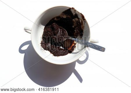 Spent Coffee In The Cup On White Background. Recycling Used Coffee Grounds In The Garden As Organic 