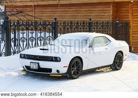 Novyy Urengoy, Russia - March 24, 2021: White American Muscle Car Dodge Challenger R/t In The City S