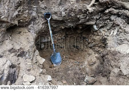 Digging In Rich Gold Laiden Gravel Hole