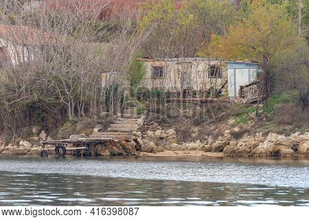 Private House With Its Own Marina. House On The Sea From Improvised Materials In The Streletskaya Ba