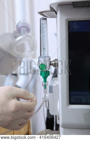 The Anesthesiologist Turns On The Machine For Artificial Ventilation Of The Lungs. Surgery Under Ane
