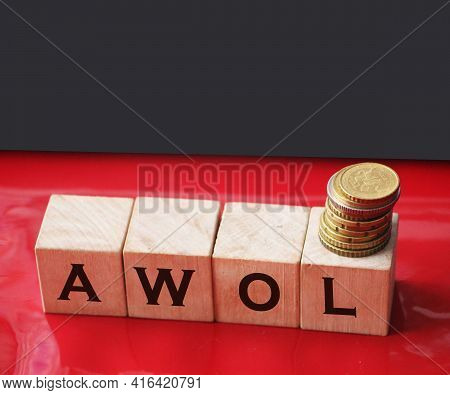 Wooden Cubes With Abbreviation Awol, And Coins On Red Background. Business Finacial Concept Of Taxat