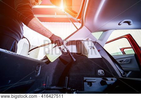 A Car Service Worker Cleans Interiror With A Special Foam Generator