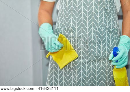 Bearded Man In Gloves With Cleaning Stuff, Rag, Disinfectant Spray Bottle In Hand