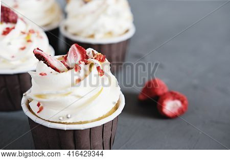Close Up View Of Home Made Cupcakes With Creamcheese Frosting And Dry Strawberry Decoration. Selecti