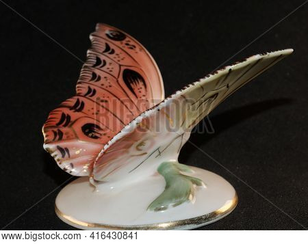 Porcelain Butterfly Figurine Isolated On Black Background