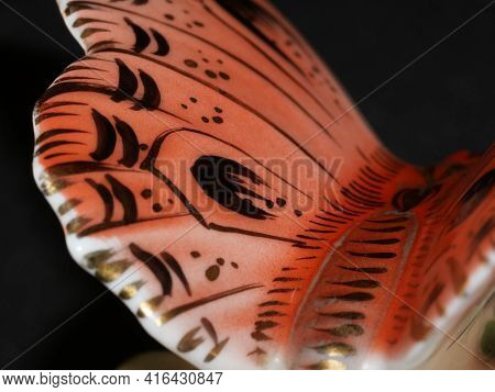 Porcelain Butterfly Figurine Isolated On Black Background