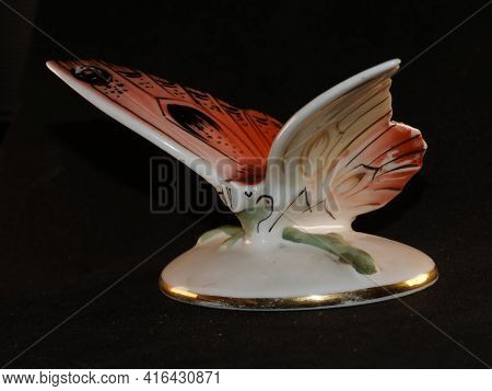 Porcelain Butterfly Figurine Isolated On Black Background