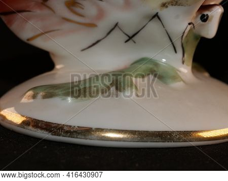 Porcelain Butterfly Figurine Isolated On Black Background