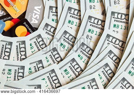 Grodno, Belarus - April 2021: A Lot Of Folded One Hundred 100 Usd Bills Layed Like Vintage Sun Beams