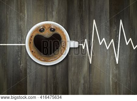 A Cup Of Coffee Is On A Gray Wooden Board With A Heart Chart.