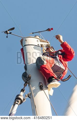 Sevastopol. Crimea. Autumn 2020. The Yachtsman Climbed The Mast. Repair Of The Device For Measuring 
