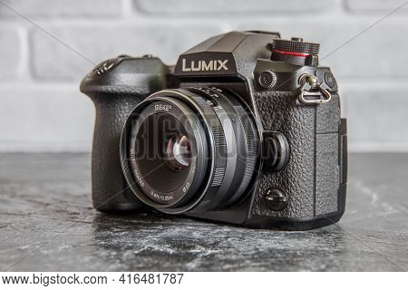 Russia, Krasnodar - April 2, 2021: Professional Panasonic G9 Micro Four Thirds Mirrorless Camera Wit