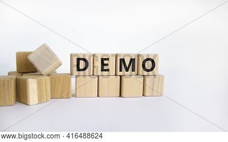 Demo Symbol. Concept Word 'demo' On Wooden Cubes On A Beautiful White Background. Business And Demo 