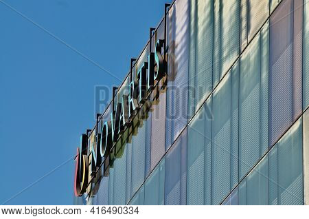 Rotkreuz, Zug, Switzerland - 28th March 2021 : Side View Of Novartis Sign Hanging At The Building In