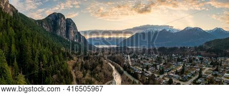 Aerial Panoramic View Of Chief Mountain And Residential Homes In A Quite Neighborhood. Colorful Suns