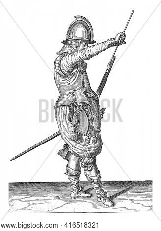 Soldier removing his ramrod from the holder under the course of his rudder, vintage engraving.